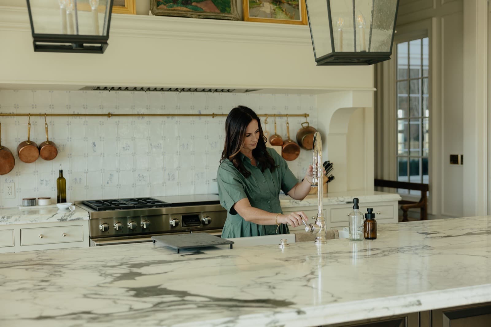 Nicki Christensen at a kitchen island in a Utah home